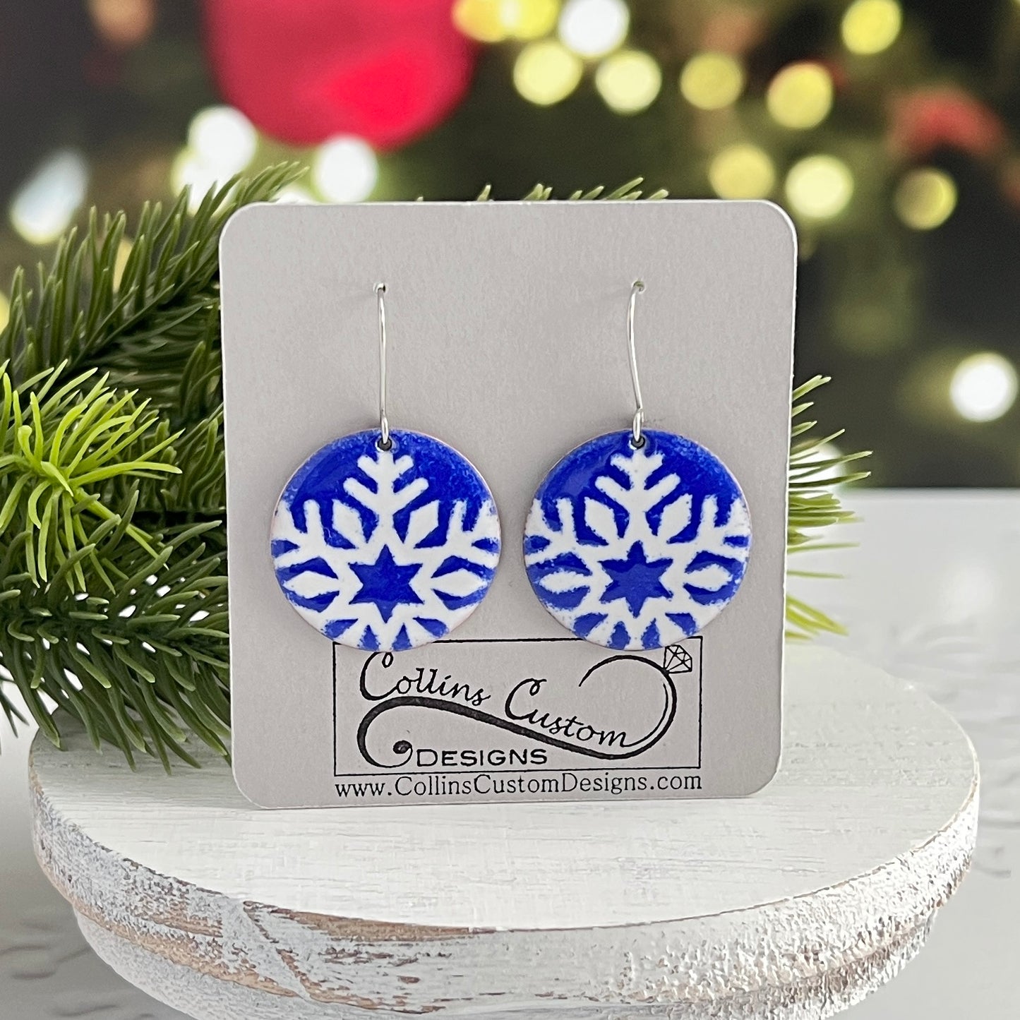 Blue Enamel Round Earrings With White Partial Snowflakes
