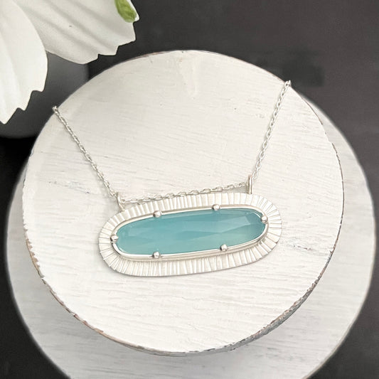 Sterling Silver Paraiba Blue Chalcedony Necklace with Radiant Stamped Border