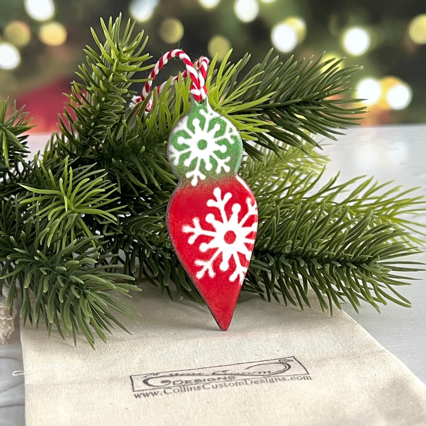Red and Green Pointed Ornament With White Snowflakes